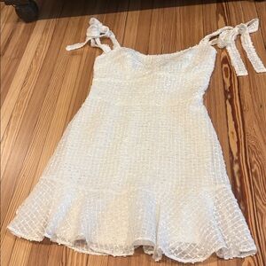 Elegant White Textured Dress with Bow Straps